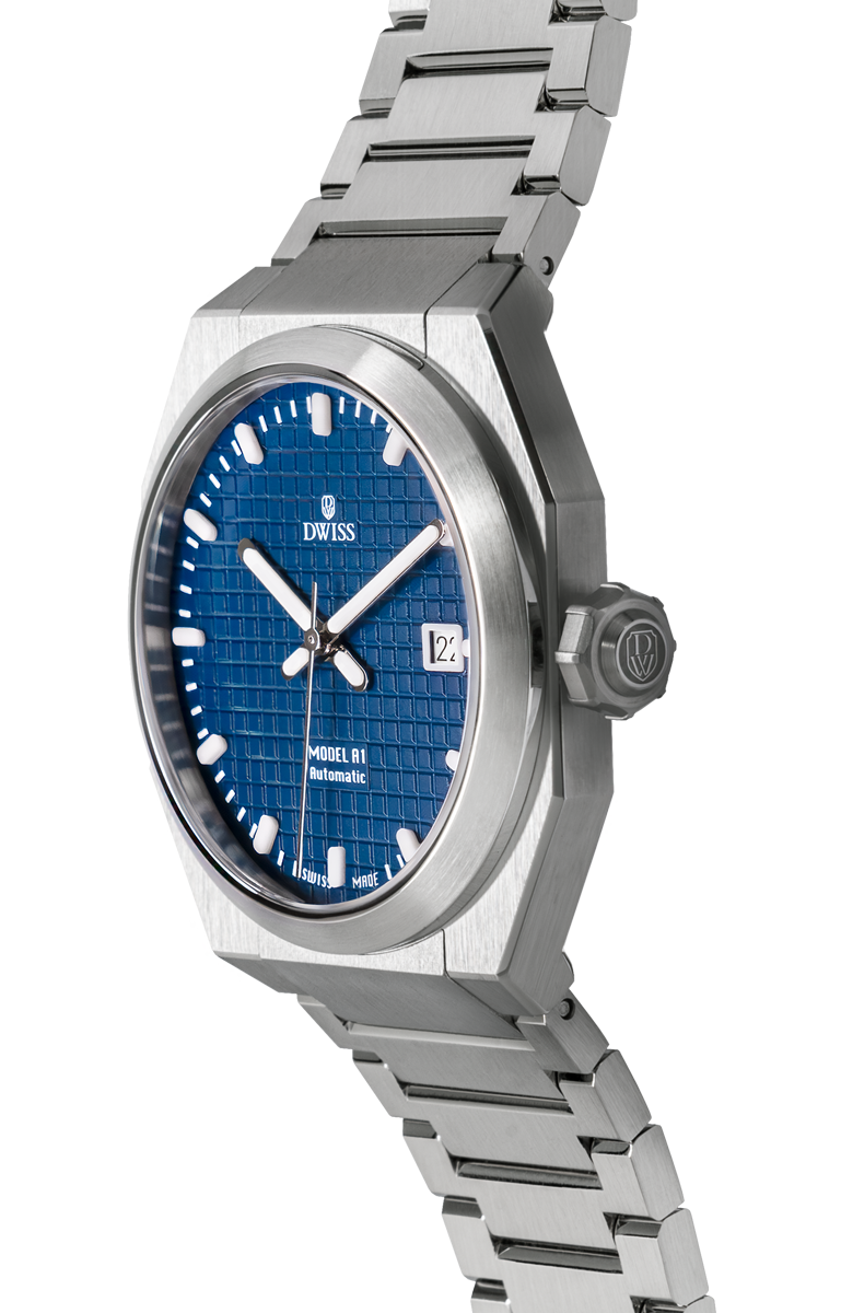 DWISS A1 - Blue dial 3/4 picture
SWISS MADE AUTOMATIC WRIST WATCH
68 hours power reserve and solid Super LumiNova® blocks
Dimension: 40 mm diameter wide, lug to lug 45,5 mm, 10,8 mm thickness.
Movement: Swiss made automatic movement
La Joux-Perret G100 Soigné
Number of jewels: 24,
Frequency 4Hz – 28’800
Power reserve 68 hours
Case: 316L Stainless Steel.
Dial: Tapesserie Blue with Super LumiNova® C1 X1 BL blocks
Luminous: Hands, Indexes and date window.
Glass (crystal): Sapphire crystal