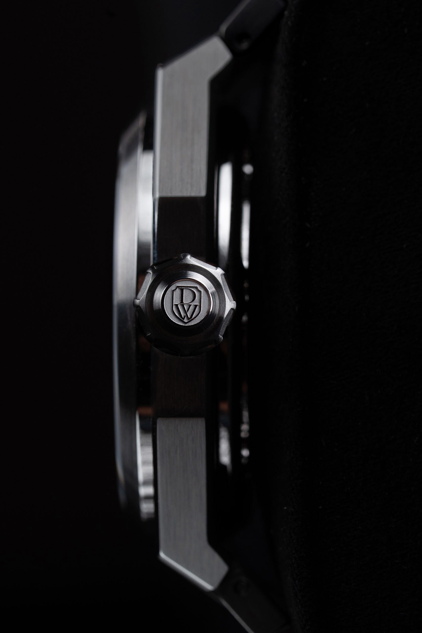 Close-up of the DWISS model A1 watch with a screw down crown view on a black background