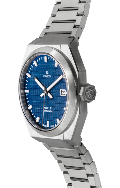 DWISS A1 - Blue dial 3/4 picture
SWISS MADE AUTOMATIC WRIST WATCH 
68 hours power reserve and solid Super LumiNova® blocks
Dimension: 40 mm diameter wide, lug to lug 45,5 mm, 10,8 mm thickness.
Movement: Swiss made automatic movement 
La Joux-Perret G100 Soigné
Number of jewels: 24,
Frequency 4Hz – 28’800
Power reserve 68 hours
Case: 316L Stainless Steel.
Dial: Tapesserie Blue with Super LumiNova® C1 X1 BL blocks
Luminous: Hands, Indexes and date window.
Glass (crystal): Sapphire crystal