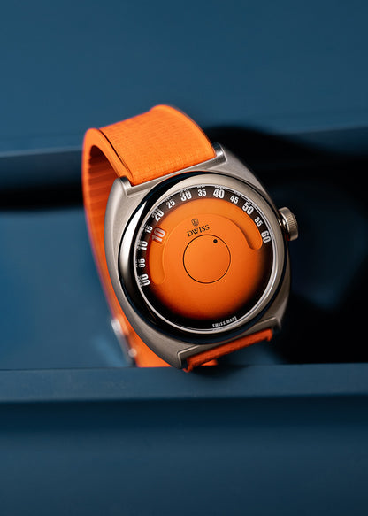 DWISS S1 Wandering Hours Orange with black gradient fume dial. A wristwatch with a bright orange strap and an orange dial, set against a dark blue background. The watch has a silver-toned metal case with a circular bezel and a visible 'DWISS' brand logo on the dial.